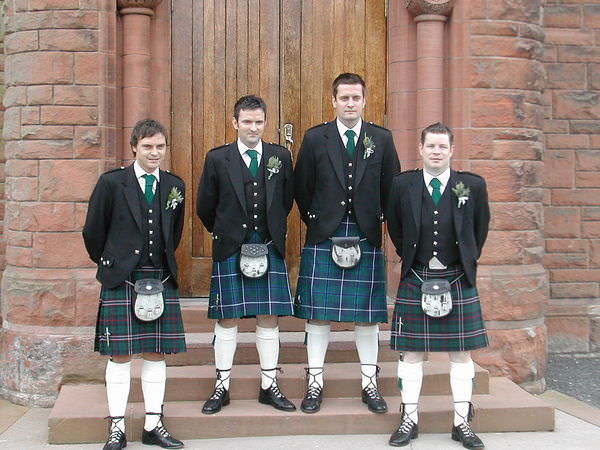 1024px-The_groom_and_his_best_man_and_ushers